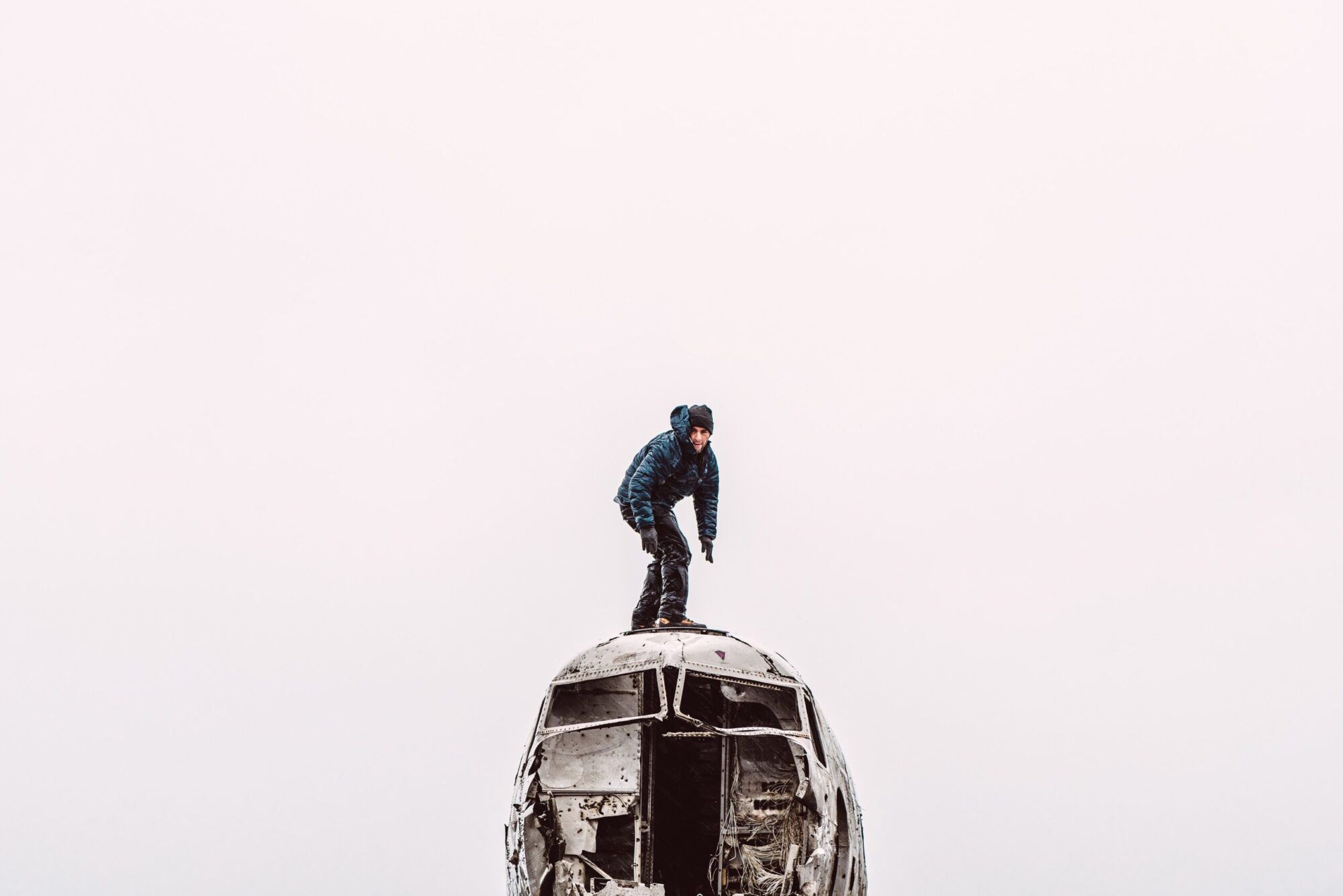 Adam Swartz on top of an abandoned aircraft